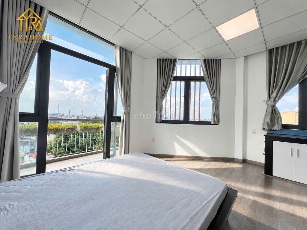 A super estate suite. A bedroom-- a balcony -- separate kitchen -- right into the page.