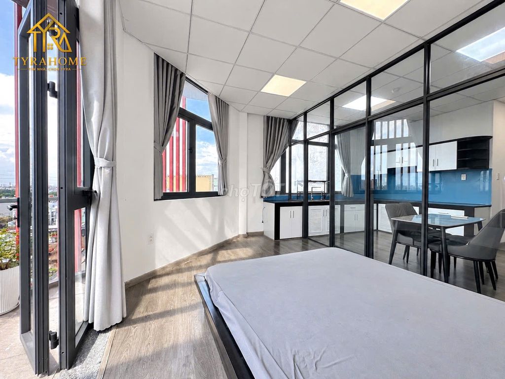 A super estate suite. A bedroom-- a balcony -- separate kitchen -- right into the page.