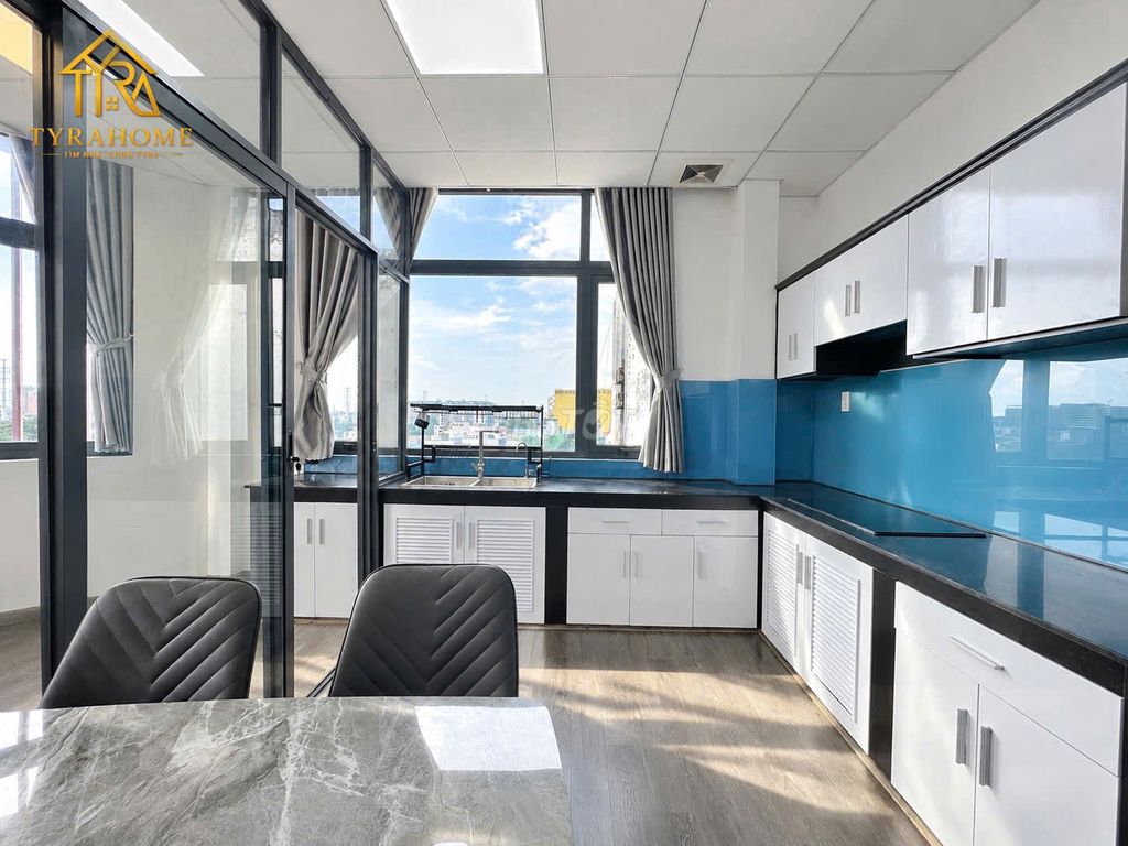 A super estate suite. A bedroom-- a balcony -- separate kitchen -- right into the page.