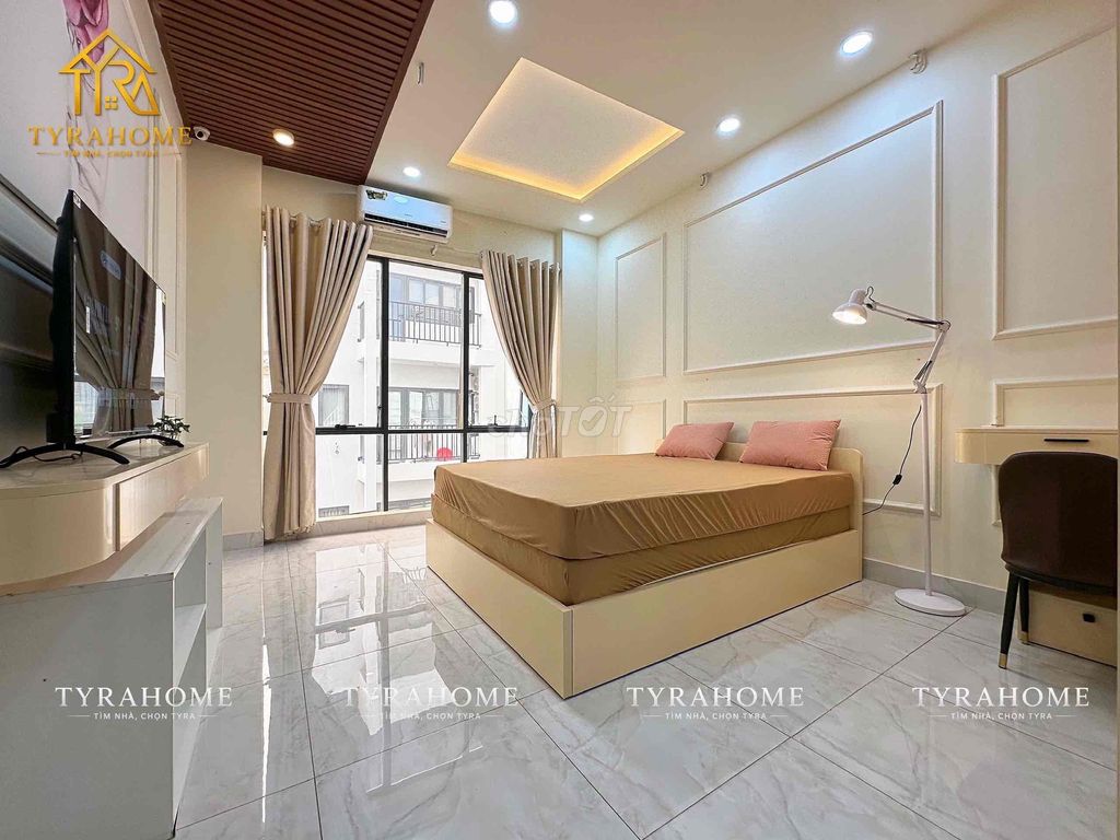 A hyper-max. A bedroom. A balcony.