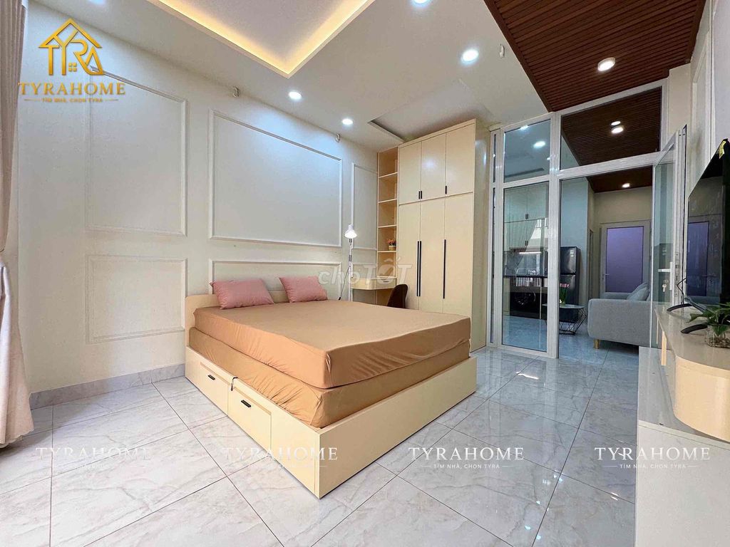 A hyper-max. A bedroom. A balcony.