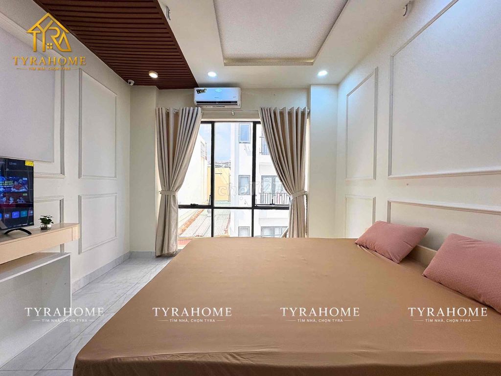 A hyper-max. A bedroom. A balcony.
