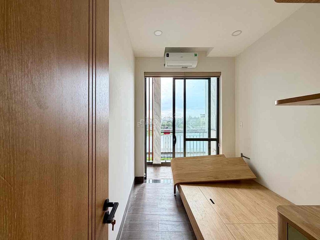 Two bedrooms, one room view river and a balcony balconies