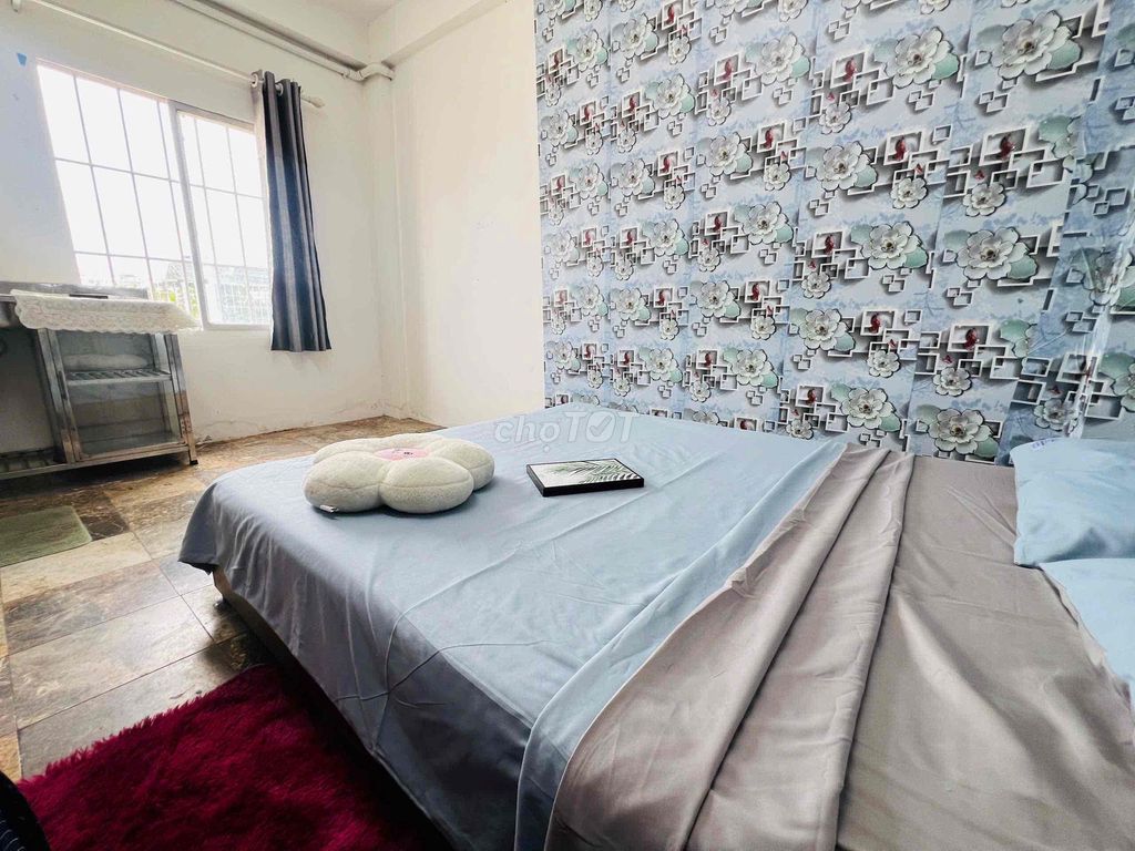 The window room has a mattress across from the west stop.