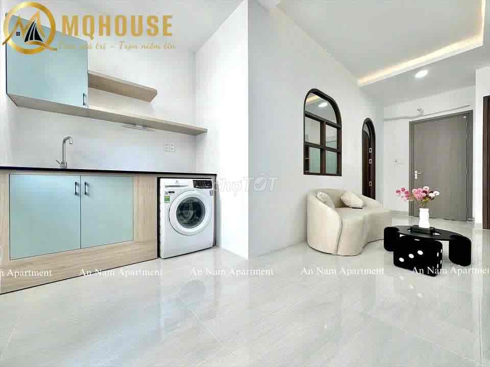 The apartment with the open windows in the center