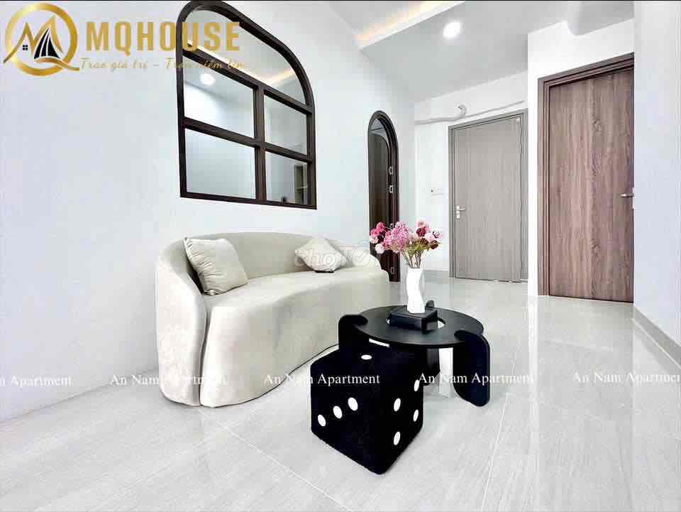The apartment with the open windows in the center