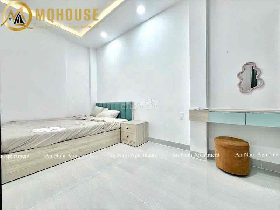 The apartment with the open windows in the center