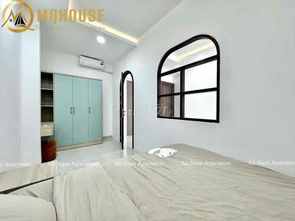 The apartment with the open windows in the center