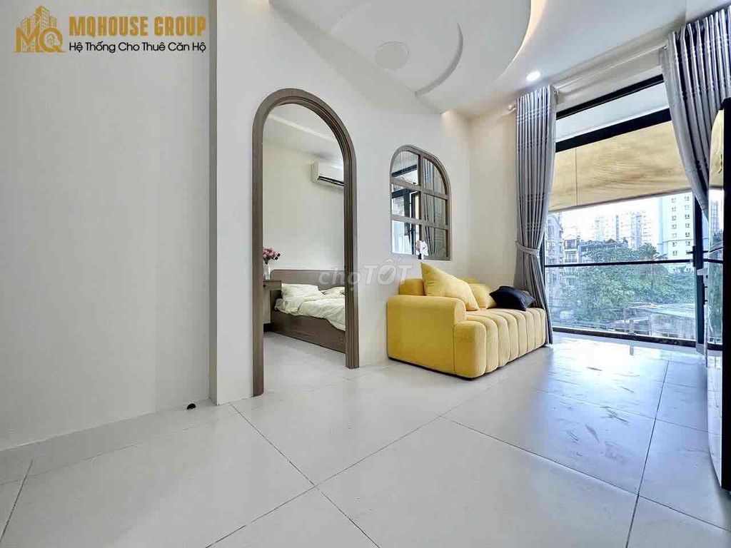 The apartment with the open windows in the center