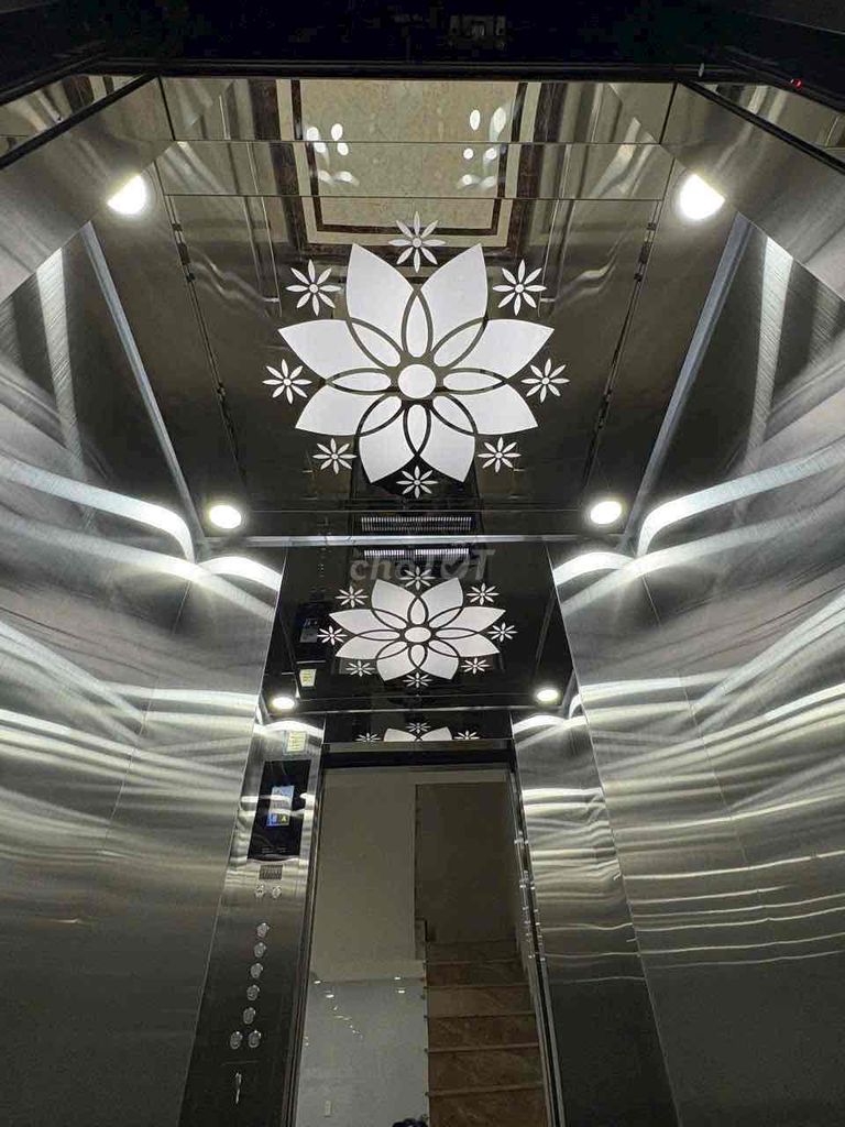 Five-story building with an empty elevator vault.