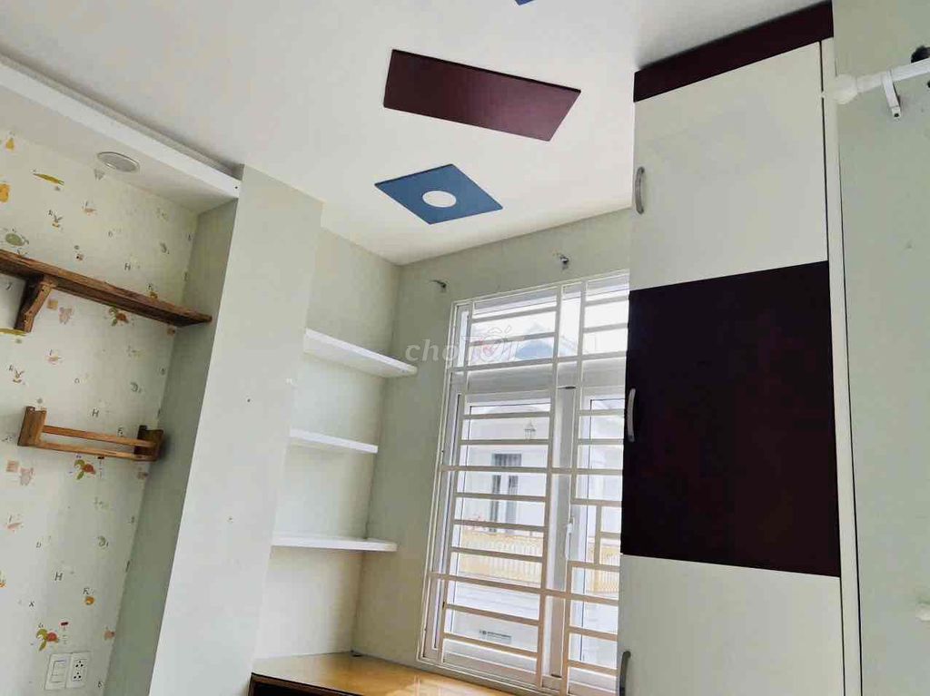 4th floor bedroom with interior furniture across the block. Two sides.