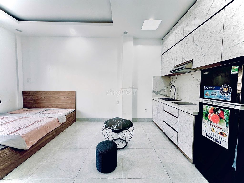 The studio - a bedroom right near the corner of the blue line, the empty park.