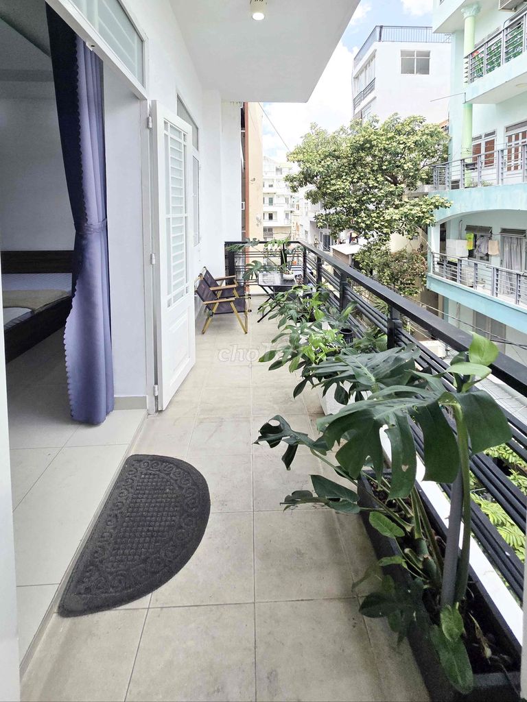 Room service. A full bedroom with a clear balcony.