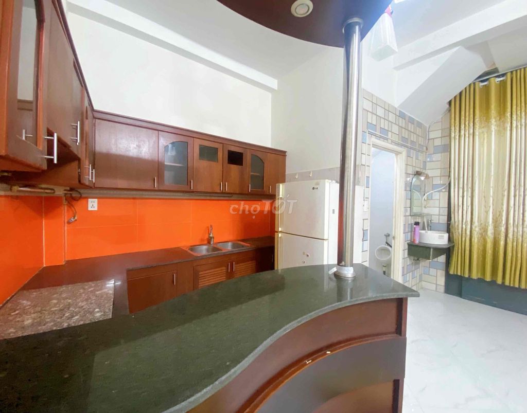 The ground floor studio is full of furniture.