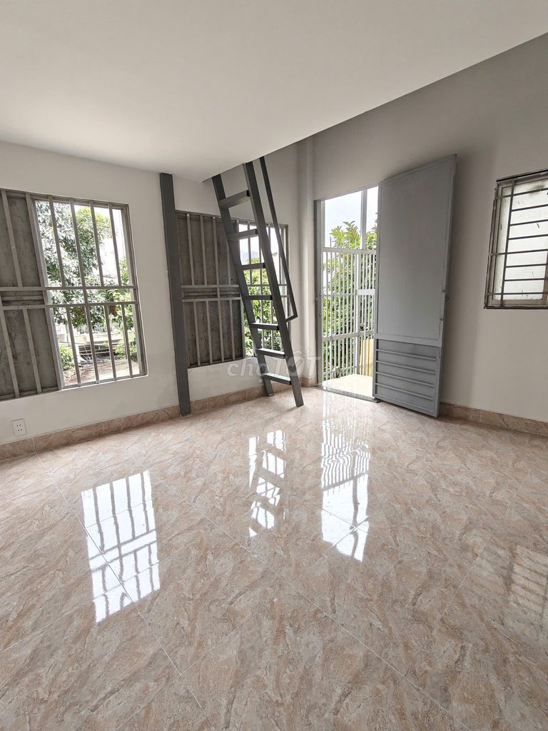 The new room has the balcony, many windows, very open near the Literal Way.