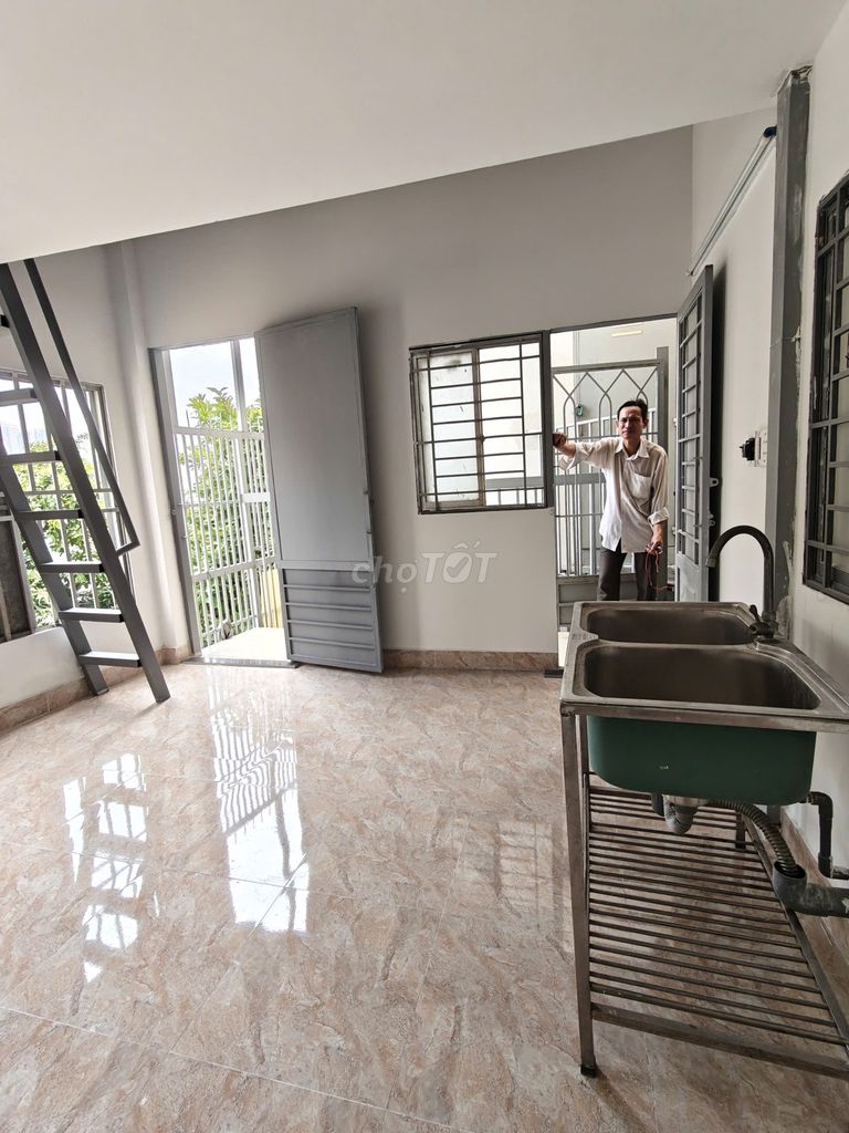 The new room has the balcony, many windows, very open near the Literal Way.