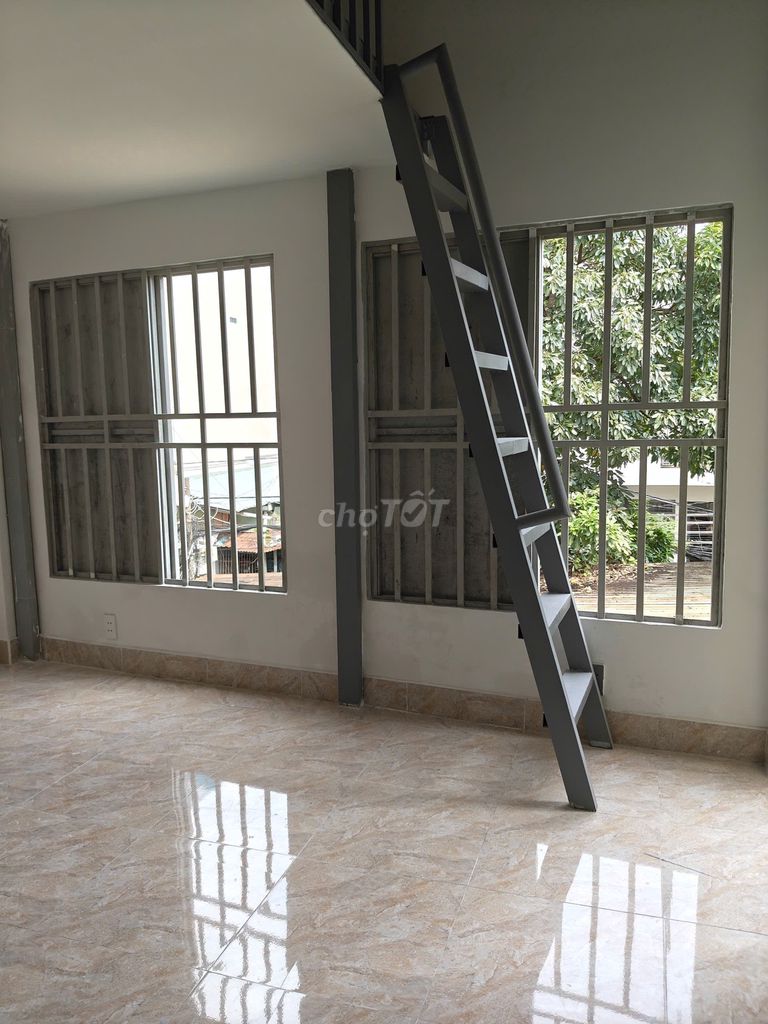 The new room has the balcony, many windows, very open near the Literal Way.