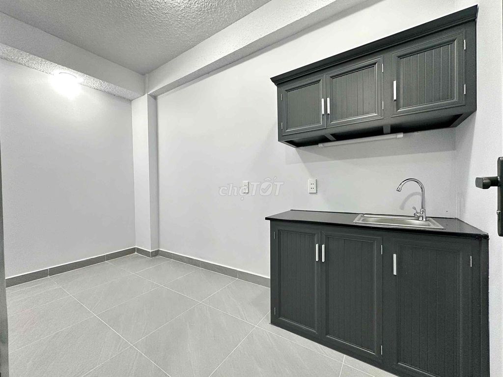 The mini apartment. One bedroom, wide open kitchen under ground.