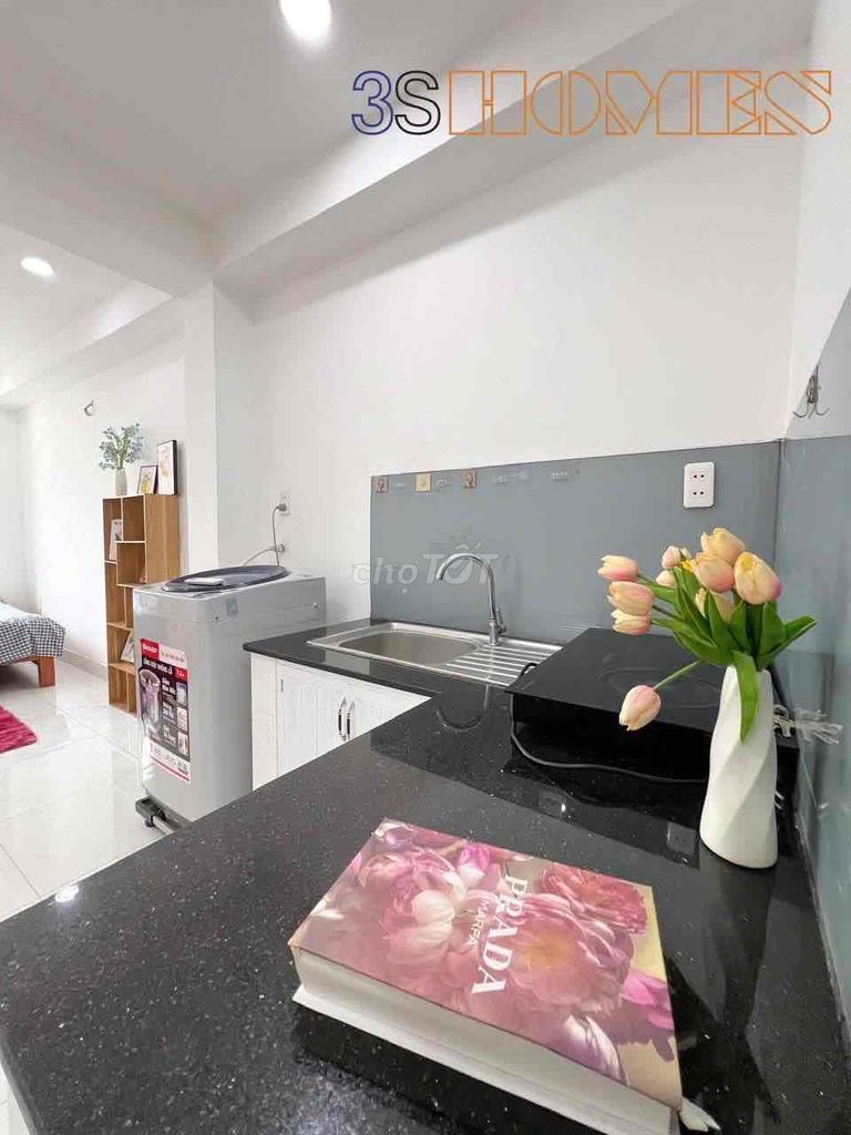 Wide studio interior, separate washing machine