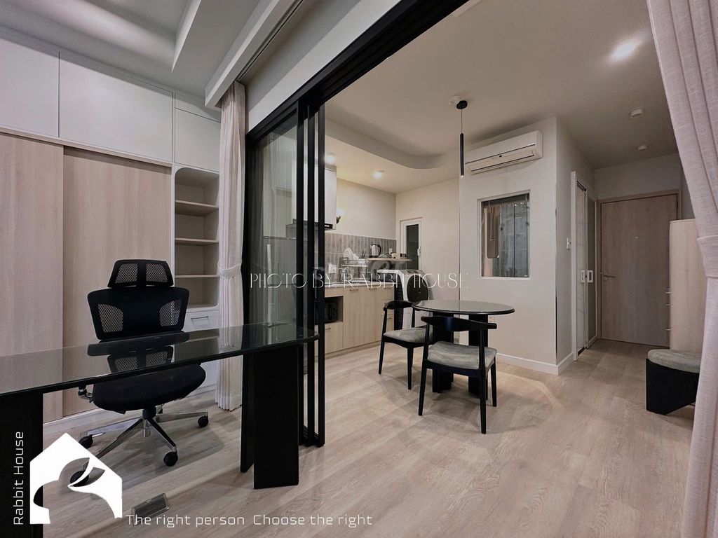 The kitchen room is full of furniture at the next green row--xnvt.