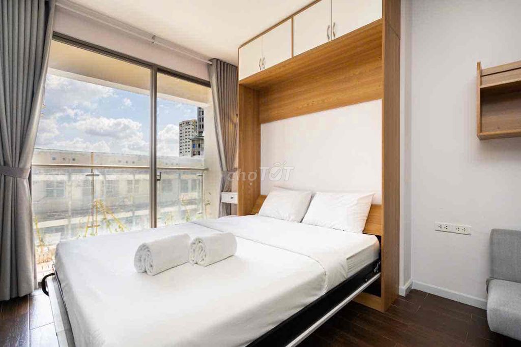 The studio apartment has a full balconies. Masteri Millennium.