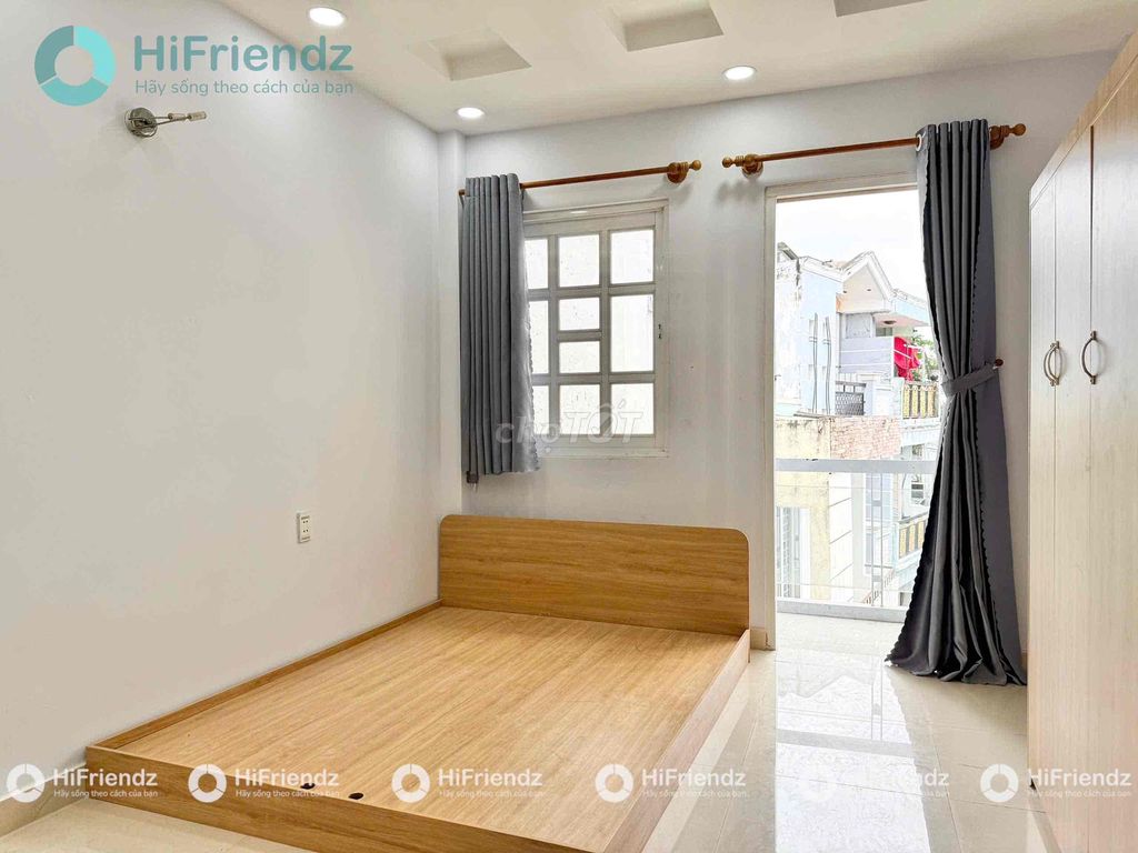 The balcony studio is full of furniture at the center.