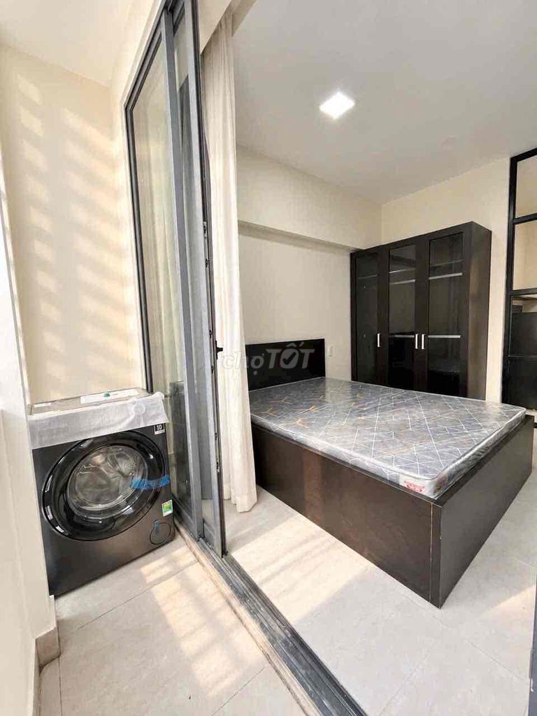 A new kitchen is open in a balcony bedroom.
