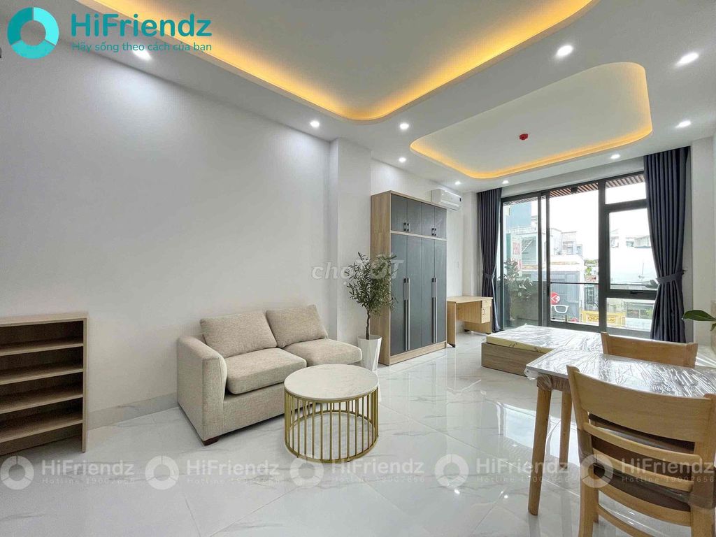 The studio is eight rooms full of furniture in a service apartment building.