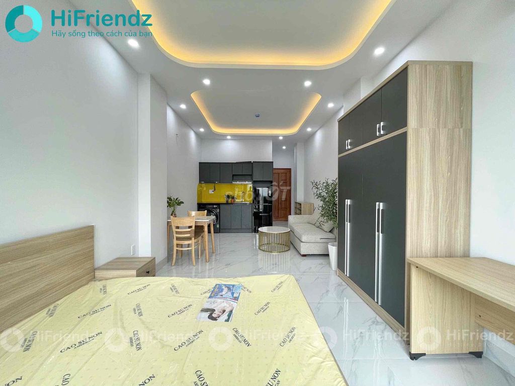 The studio is eight rooms full of furniture in a service apartment building.
