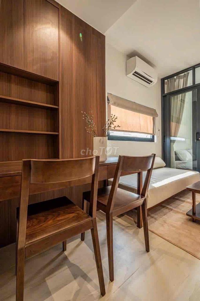 A large balcony bedroom full of furniture