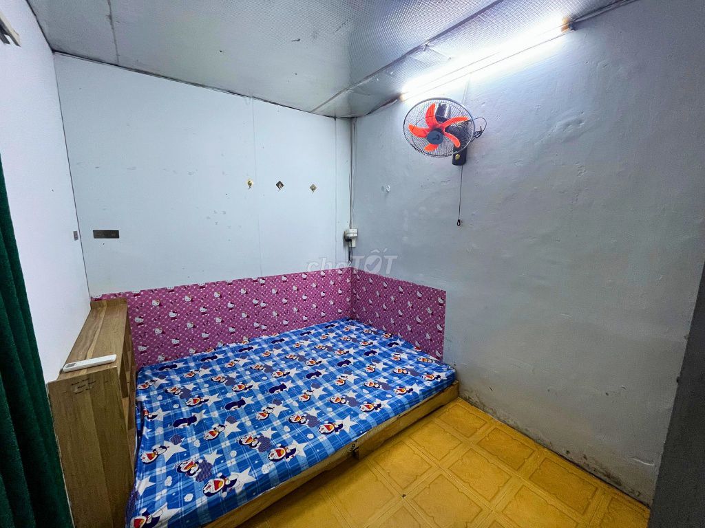 Three students in the District Inn. - There's an interior - private toilet.