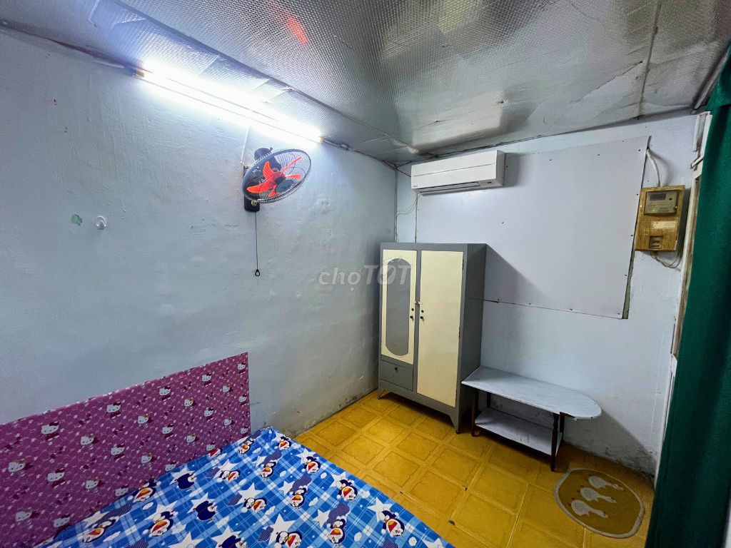 Three students in the District Inn. - There's an interior - private toilet.