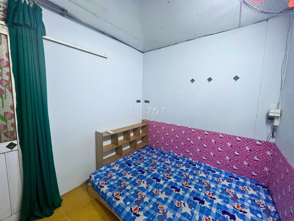 Three students in the District Inn. - There's an interior - private toilet.