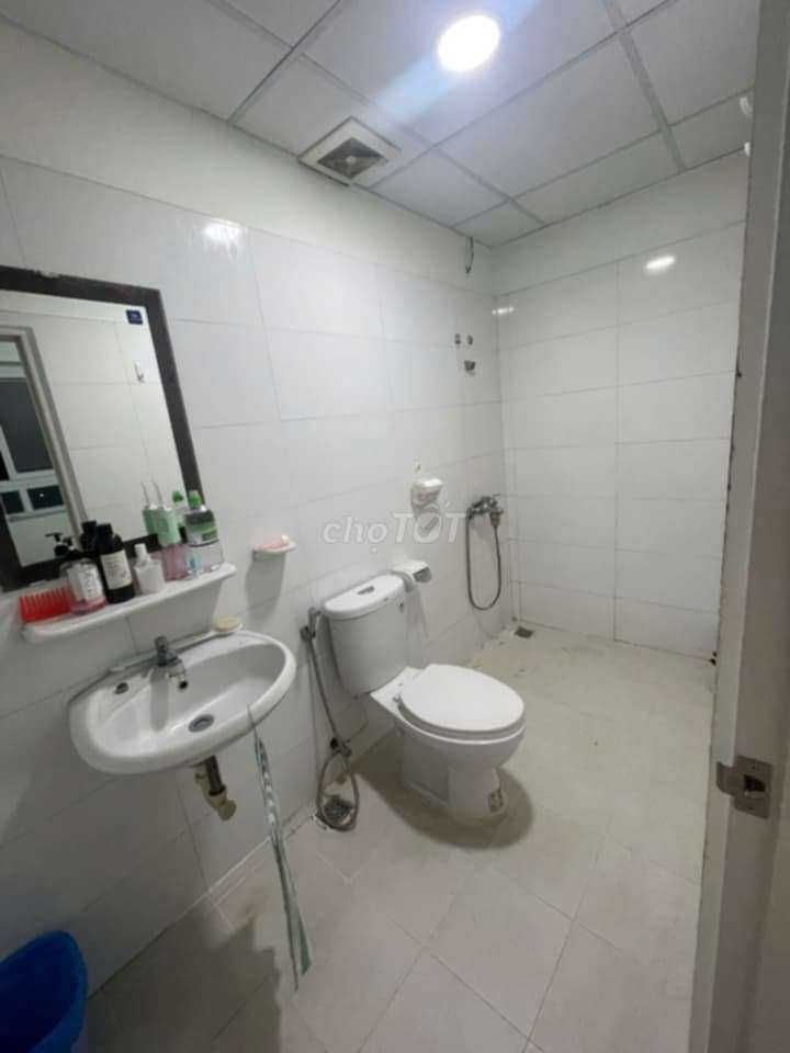 Pass a bedroom with a private bathroom in the apartment.