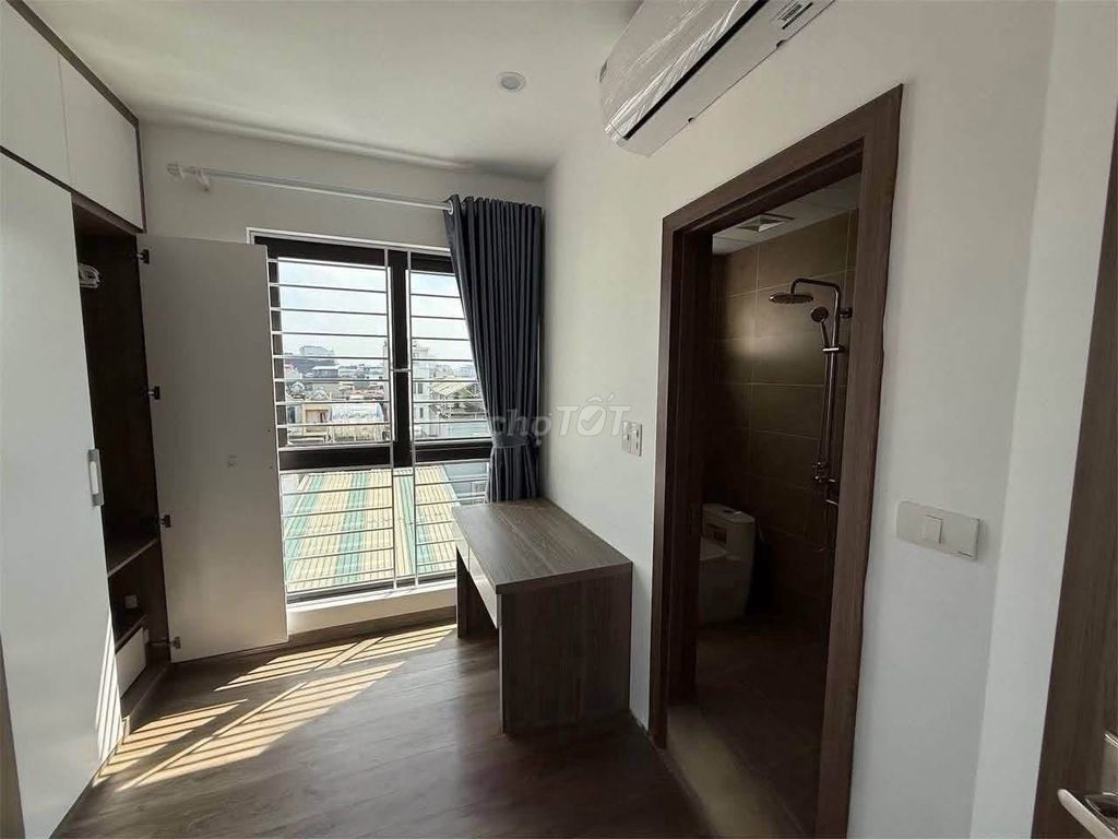 A niceBùi Đình Tuý-view bedroom with a private washing machine