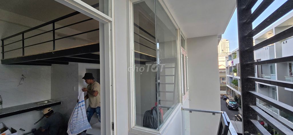 The balcony's got a beautiful panorama window.