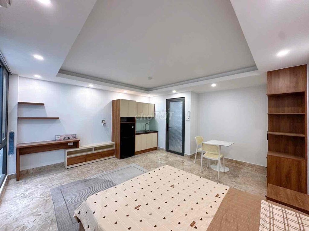 The new mini building is Tân Sơn Nhì.