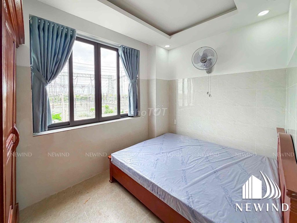 The studio system, a large window bedroom full of furniture.