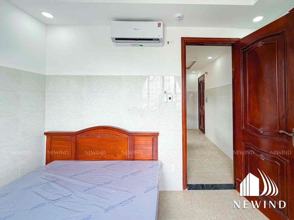 The studio system, a large window bedroom full of furniture.