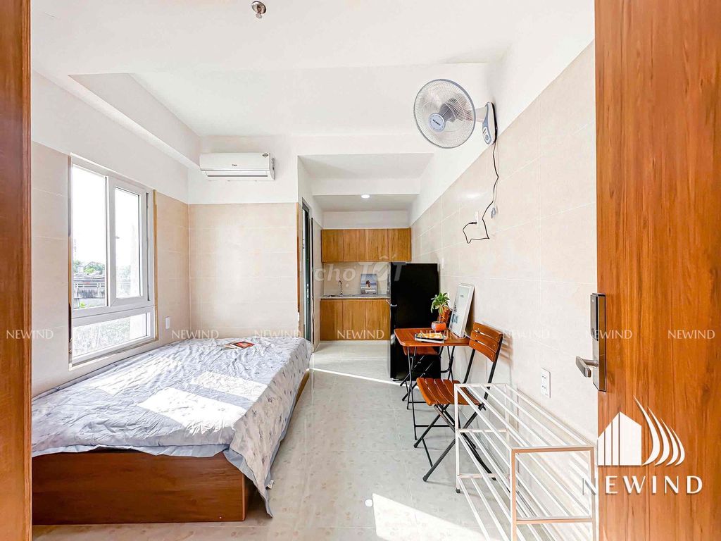 The studio system, a large window bedroom full of furniture.