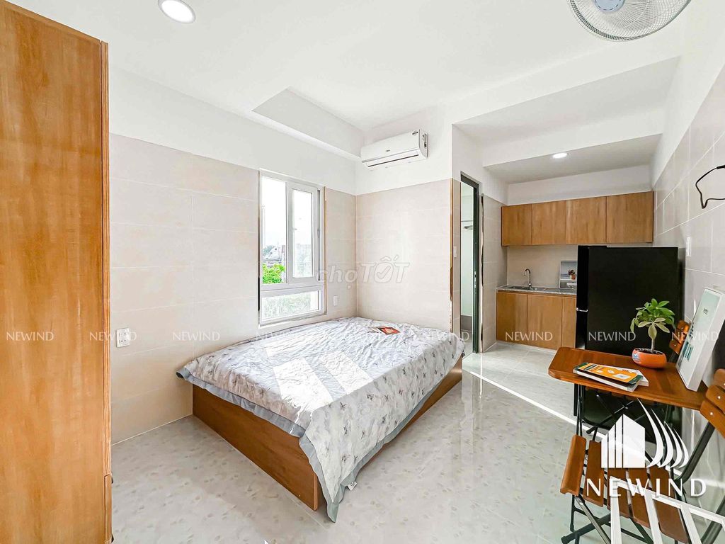 The studio system, a large window bedroom full of furniture.