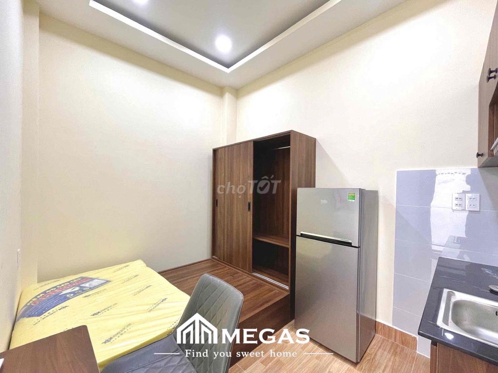 Open the studio apartment. One bedroom, right here.
