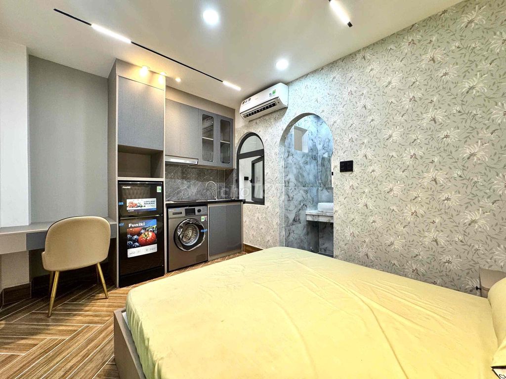 apartment is empty full of comfortable furniture near art