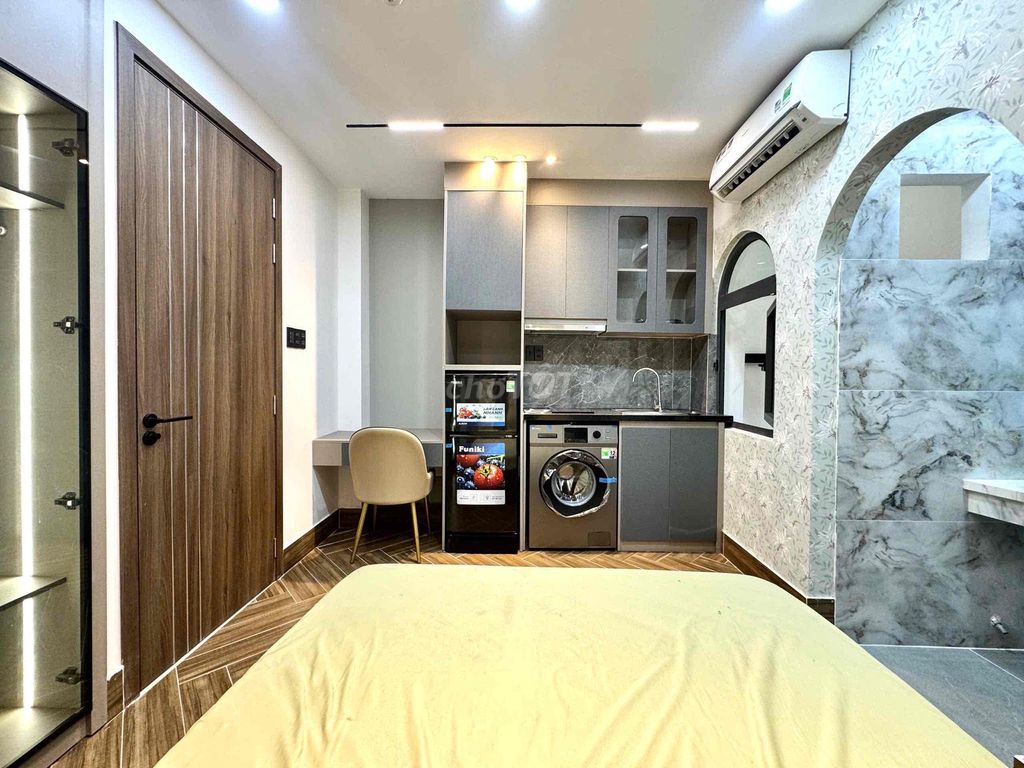 apartment is empty full of comfortable furniture near art