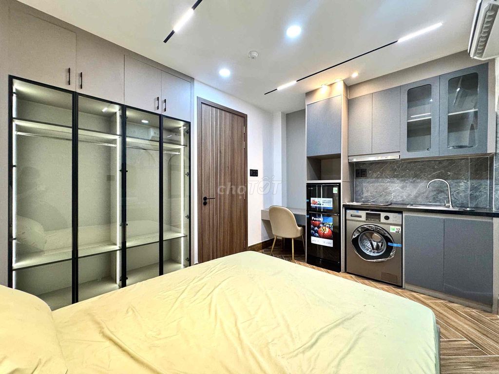 apartment is empty full of comfortable furniture near art