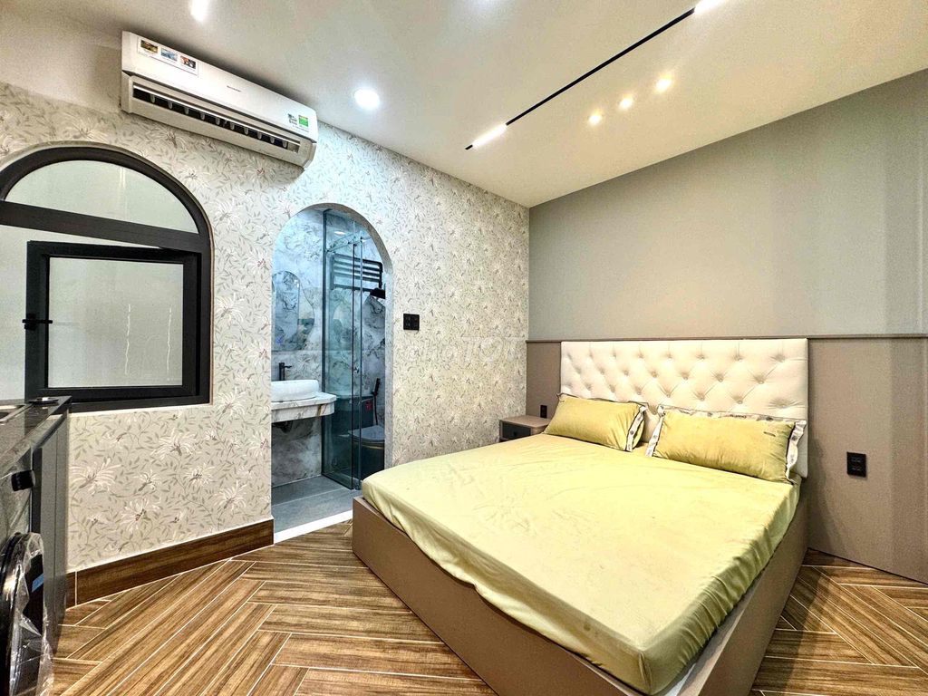apartment is empty full of comfortable furniture near art