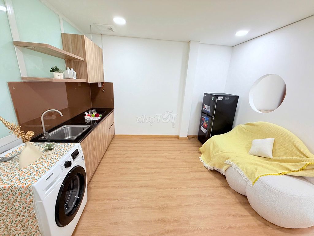 A kitchen room with a private washing machine.