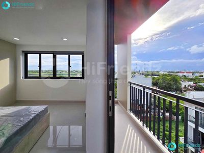A bedroom near a balcony bridge, nice, open interior.