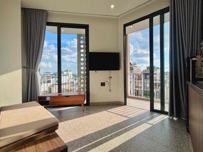 One bedroom, the balcony surrounding the house in downtown District 3.