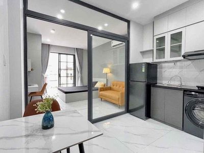 The studio apartment is full of furniture - right around the back of the father. - The balcony.